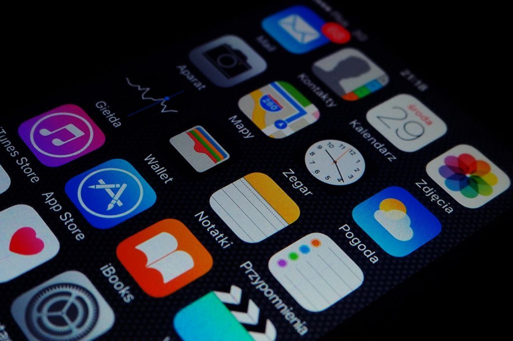 The Art of Drawing Readers In: Your attractive post title goes here Close-up view of smartphone displaying various apps on the home screen.